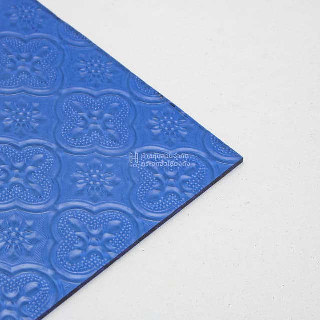 corner of blue floral patterned glass