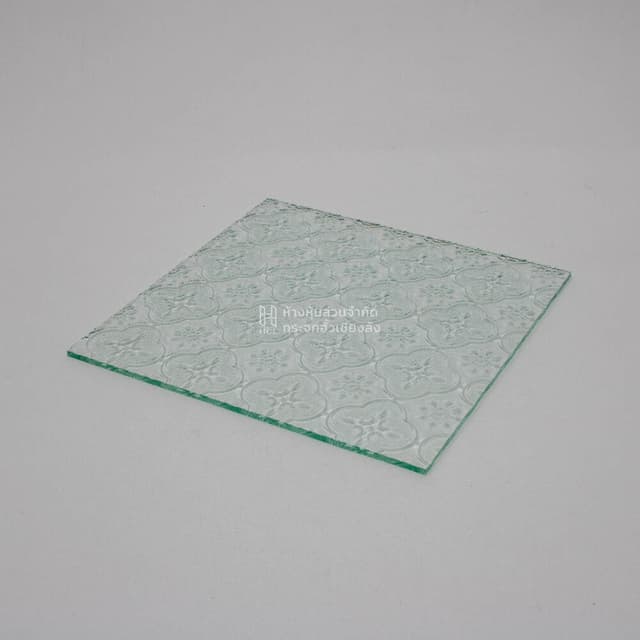 corner of clear floral patterned glass