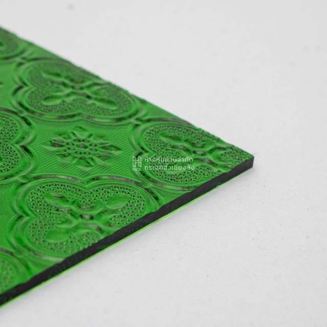 sheet of green floral patterned glass