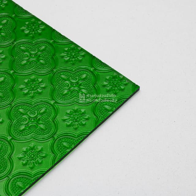 corner of green floral patterned glass