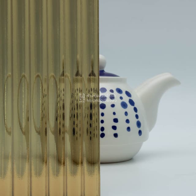 a tea kettle with and without gold moru patterned glass