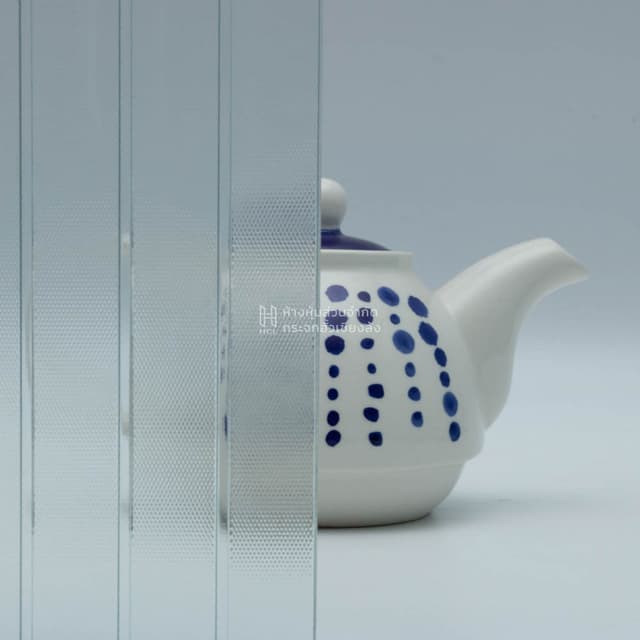 a tea kettle with and without neon patterned glass