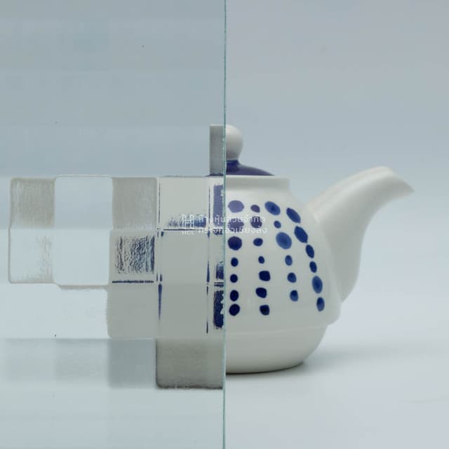 a tea kettle with and without square patterned glass